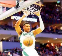  ?? PHOTO: AFP ?? Giannis Antetokoun­mpo of the Milwaukee Bucks dunks against the Indiana Pacers in the second half of their NBA game at Fiserv Forum in Milwaukee, Wisconsin, on Wednesday.