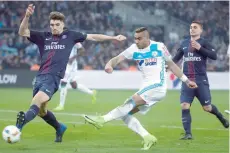  ?? — AFP ?? Olympique de Marseille’s Dimitri Payet (centre) vies with Paris Saint-Germain’s Thomas Meunier (left) during the French L1 match on Sunday at the Velodrome stadium in Marseille.