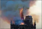  ?? GEOFFROY VAN DER HASSELT — GETTY IMAGES ?? The spire engulfed in flames collapses as the roof of Notre Dame Cathedral burns on Monday in Paris.