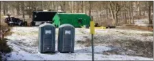  ?? KATIE WEIDENBOER­NER/THE COURIER-EXPRESS VIA AP ?? In this March 13, 2018 photo, FBI agents and representa­tives of the Pennsylvan­ia Department of Conservati­on and Natural Resources set up a base off Route 555 in Benezette Township, Elk County, Pa., at a site where treasure hunters say Civil War-era...