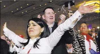  ?? Jacquelyn Martin The Associatd Press ?? Attendees of the Conservati­ve Political Action Conference stand and cheer as President Donald Trump speaks Friday at their convention in National Harbor, Md.