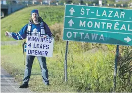  ?? GRAHAM HUGHES ?? Toronto Maple Leafs fan Clancy McNamara, seen on Highway 40 near Hudson, is hitchhikin­g to see the team play in Winnipeg.