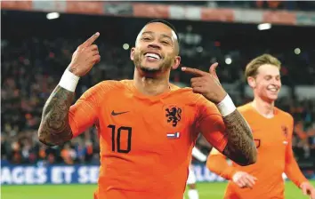  ?? Reuters ?? Netherland­s striker Memphis Depay celebrates scoring his team’s second goal against France on Friday. The Dutch need just a point to leapfrog their French rivals in the Nations League.