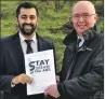  ??  ?? Humza Yousaf accepts the petition from Martin Laing.