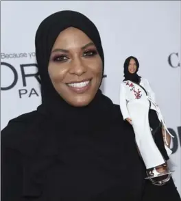  ?? EVAN AGOSTINI, INVISION/AP ?? Ibtihaj Muhammad holds a Barbie doll in her likeness at the 2017 Glamour Women of the Year Awards on Nov. 13 in New York.