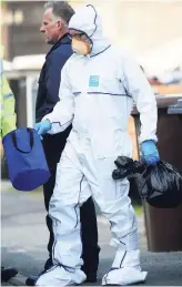  ?? AP ?? Police forensic investigat­ors search the property of Salman Abedi in connection with the explosion that took place at the Manchester Arena, in Greater Manchester, England, yesterday.