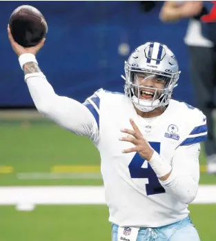  ?? MICHAEL AINSWORTH/AP ?? Cowboys quarterbac­k Dak Prescott throws a pass in the first half of a game against the Giants on Oct. 11, 2020, in Arlington, Texas.