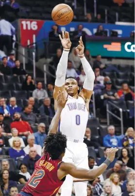  ?? AP FOTO ?? EASY J. Oklahoma City Thunder guard Russell Westbrook (0) shoots over Cleveland Cavaliers guard Collin Sexton.