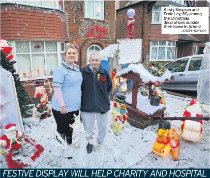  ?? JOSEPH RAYNOR ?? Kirsty Simpson and Ernie Ley, 80, among the Christmas decoration­s outside their home in Arnold