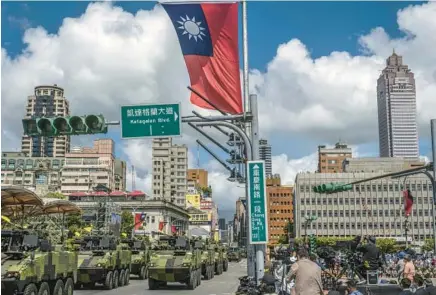  ?? LAM YIK FEI/THE NEW YORK TIMES ?? Military vehicles in a parade in Taipei, Taiwan, on Oct. 10, 2021. President Joe Biden indicated he would use military force to defend Taiwan if it were ever attacked by China.