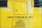  ?? ALYSSA POINTER / ALYSSA.POINTER@AJC.COM ?? Only liquified petroleum gas is used to operate the propane buses at the transporta­tion office in Alpharetta.