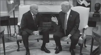  ?? Evan Vucci/AP ?? Sworn in: President Donald Trump talks with new White House Chief of Staff John Kelly after he was privately sworn in during a ceremony in the Oval Office Monday in Washington.