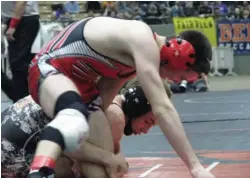  ?? STAFF PHOTO BY PATRICK MACCOON ?? Signal Mountain 113-pounder Daniel Uhorchuk, top, capped off a perfect season with a state championsh­ip in the Class A/AA finals Saturday in Franklin.