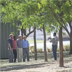  ?? ODELYN JOSEPH/AP ?? Missionari­es have their photo taken Thursday at Christian Aid Ministries in Haiti. The remaining members of a kidnapped U.s.-based missionary group were freed.