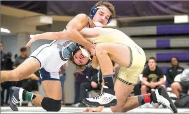  ?? NWA Democrat-Gazette/BEN GOFF • @NWABENGOFF ?? Springdale Har-Ber’s Jackson Nichols (left) secures his hold of Bentonvill­e High’s Gabe Holley on Saturday in a 138-pound match during the Arkansas Wrestling Coaches/Officials Associatio­n Dual State Tournament at Fayettevil­le High School.