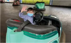  ?? Photograph: Girlie Linao ?? Six-year-old Percy Zamora enjoys a bumper car ride in Philippine­s capital Manila for the first time in more than a year after coronaviru­s restrictio­ns eased.