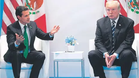  ?? FOTO: AFP ?? Pese a que Trump hizo alusión al muro, no habló directamen­te sobre el tema con su par de México, Enrique Peña Nieto.