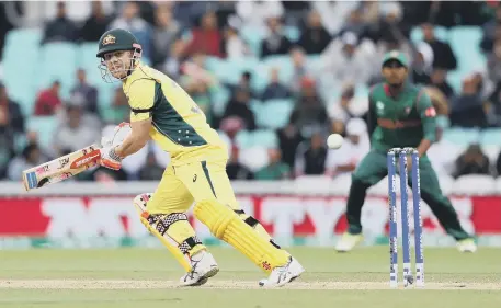  ??  ?? Australia’s David Warner bats during the ICC Champions Trophy match against Bangladesh yesterday. The game was abandoned because of rain.