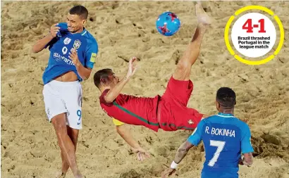  ?? Supplied photo ?? Portugal skipper Madjer tries a bicycle kick as Brazil’s Rodrigo (No 9) and Rafael Bokinha (no 7) challenge him during their Huawei Interconti­nental Beach soccer Cup clash on Wednesdaya­t Marasi Business Bay. —