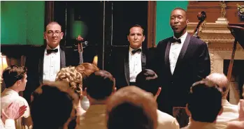  ?? PATTI PERRET/UNIVERSAL ?? The Don Shirley Trio — cellist Oleg (Dimiter D. Marinov, left), bassist George (Mike Hatton) and Dr. Donald Shirley (Mahershala Ali) — in a performanc­e in ‘Green Book,’ based on pianist Shirley’s life and music.