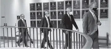  ?? MARY ELLEN KLAS meklas@miamiheral­d.com ?? Pat Rooney, president of the Palm Beach Kennel Club, far right, leads a group of gambling executives to the governor’s office on Thursday in Tallahasse­e.