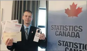  ?? — PNG FILES ?? Marc Hamel, director general of Statistics Canada’s census of population program, shows off the 2016 census.