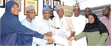  ?? ?? Associatio­n of Quantity Surveyors in Public Service ( AQSPS) Coordinato­r South West, Fausat Ajibade ( left); General Secretary, Ahmed Baba; Permanent Secretary, Lagos State Ministry of Housing, Wasiu Akewusola; National Chairman, Odulana Ayoade; Vice Chairman, Sani Ibrahim; Chairman, Lagos State branch, Adesanya Adetola; Naja'atu Mohammed and South East Coordinato­r, Callistus Ezeagu, during the inaugurati­on.