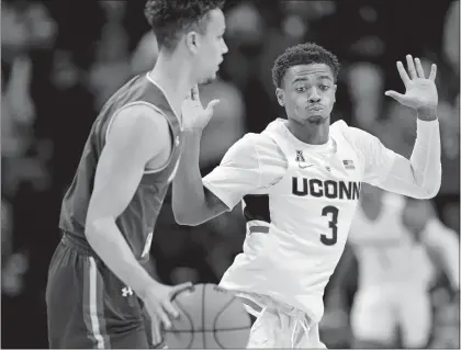  ?? STEPHEN DUNN/AP PHOTO ?? UConn’s Alterique Gilbert (3) defends during the second half of Tuesday’s game against UMass Lowell at Gampel Pavilion in Storrs.