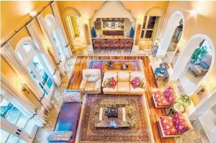  ?? BOSCHETTI ARVIDA REAL ESTATE INTEL/COURTESY PHOTOS ?? The home at 8901 Arvida Lane in the Gables Estates neighborho­od features nine full baths, three half baths, a movie theater and elevator.