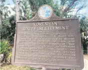  ?? JEFF KLEINMAN jkleinman@miamiheral­d.com ?? Site marker at Koreshan State Park describing the group’s legacy.