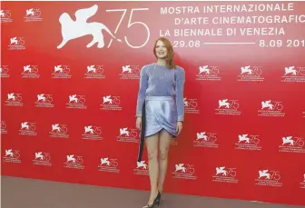 ?? AP PHOTO ?? HIGH HOPES: Emma Stone, above, star of ‘The Favourite,’ below, attends the Venice Film Festival yesterday.