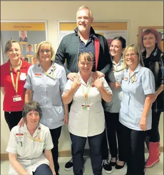  ??  ?? Greg Davies and staff at Loros Hospice. The comedian and TV star is the latest famous name to be added to the hospice’s list of patrons. He joins the likes of England rugby legend Martin Johnson, left, who is also a patron