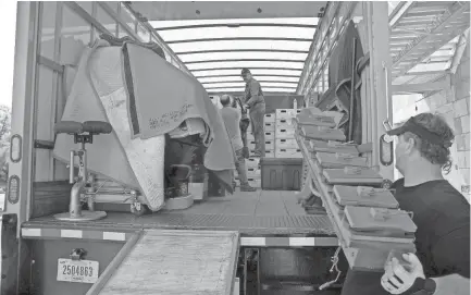  ??  ?? June 28, 2018 - The Orpheum's Wurlitzer pipe organ rests safely covered as workers continue to load the rest of the dismantled organ for transport. The iconic organ will travel to Chicago where it will spend the next 18 months undergoing a complete...