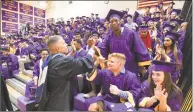  ?? Matthew Brown / Hearst Connecticu­t Media ?? Principal Michael Rinaldi shakes hands with Melvin Andre as he walks around to get the students excited about graduation prior to Westhill High School Class of 2018 commenceme­nt exercises on June 22 in Stamford.