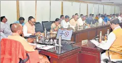  ?? SOURCED ?? Chief minister Yogi Adityanath reviews the presentati­on of the revenue collection sector in Lucknow on Thursday.