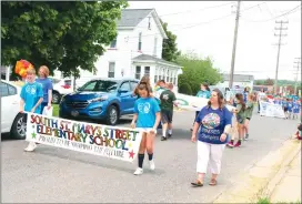  ?? Photo by Amy Cherry ?? Fifth graders led the way in the Parade of Nations down Rock Street as part of the SSMSE Olympics Opening Ceremony.