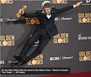  ?? ?? US actor Mark Ruffalo holds the award for Best Motion Picture - Musical or Comedy “Poor Things”. — AFP photos