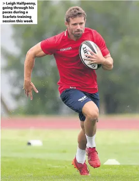  ??  ?? > Leigh Halfpenny, going through his paces during a Scarlets training session this week