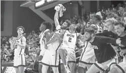  ?? ZAC BONDURANT ?? The Grand Canyon bench goes crazy as they open the lead on UTSA during Thursday’s game.