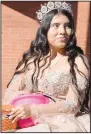  ?? (Special to NWA DemocratGa­zette/Yeferson Cordona) ?? Evelyn Cordona throws candy to waiting students as she rides down Main Street during the parade.