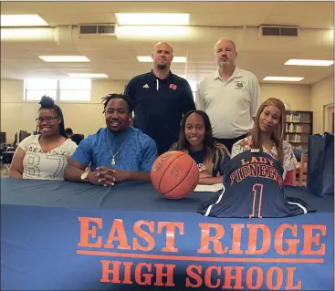  ??  ?? On hand to see Jayla Stone (seated, second from right) of East Ridge High School sign on to play basketball with Georgia Northweste­rn were (front row, from left) Autumn Reynolds, Kentarius Hampton and Shenika Stone. On the back row are East Ridge coach...