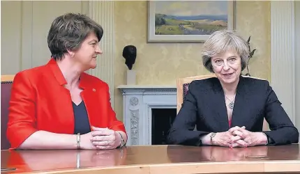  ??  ?? > Theresa May’s hopes of a deal with the Democratic Unionist Party’s Arlene Foster, left, to shore up her minority government, have hit a setback, as the Northern Irish party warned that a deal was ‘certainly not imminent’