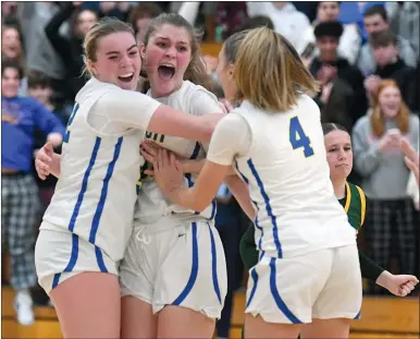  ?? Theday.com SARAH GORDON/THE DAY ?? Bacon Academy’s Cara Shea (32), Marissa Nudd (31) and Katelyn Novak (4) celebrate their 54-51 win over New London in an ECC Division II girls’ basketball game on Wednesday in Colchester. Go to to view a photo gallery.