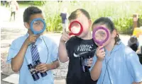  ??  ?? Schoolchil­dren take part in wildlife study