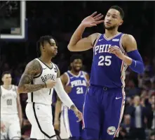  ?? CHRIS SZAGOLA — THE ASSOCIATED PRESS ?? 76ers point guard Ben Simmons, right, finally hit on a three-point shot Tuesday night in an exhibition against the Chinese team Guangzhou Loong-Lions.