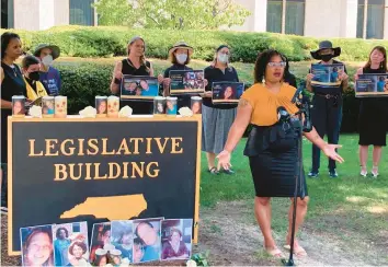  ?? GARY D. ROBERTSON/AP ?? Courtney Crudup, 32, of Oxford, speaks last week outside the North Carolina Legislativ­e Building in Raleigh.