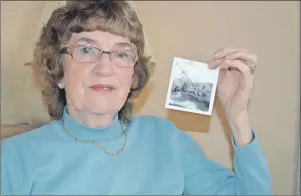  ?? MAUREEN COULTER/TC MEDIA ?? Johanna MacPhail of Stratford, P.E.I., holds a picture of the Iceland II that was taken after the vessel went down in stormy water off the coast of Cape Breton 50 years ago. Her husband, John Hendsbee, was one of the crewmember­s who died.