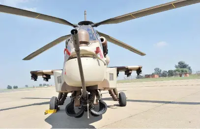  ?? Picture: AFP ?? GRIM TIMES. The company that manufactur­ed this Rooivalk armed helicopter a decade ago, Denel, has allegedly left some of its employees starving and homeless.