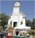  ?? Jeff Larson/appeal-democrat ?? The restored version of Smartsvill­e’s historic former Catholic church, built in 1871, was standing upright Saturday at the 13th annual Pioneer Day in Smartsvill­e.