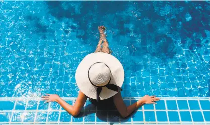  ?? Shuttersto­ck ?? A young woman relaxing in a swimming pool. Swimply, an online platform launched in 2018 that connects owners of private pools with people looking for a place to swim.